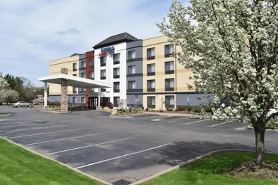 a parking lot in front of a hotel at Fairfield Inn by Marriot Binghamton in Binghamton