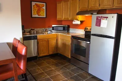 a kitchen with a white refrigerator and a microwave at Residence Inn Danbury in Danbury