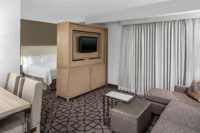 a hotel room with a bed and a television at Residence Inn by Marriott West Orange in West Orange