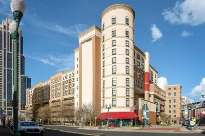 a tall white building on a city street at Residence Inn New Rochelle in New Rochelle