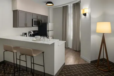a kitchen with a bar in a hotel room at Residence Inn New Rochelle in New Rochelle