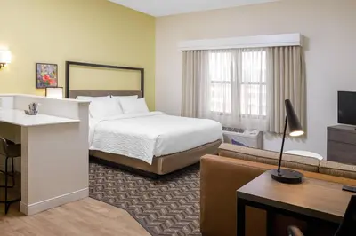 a hotel room with a bed and a desk at Residence Inn New Rochelle in New Rochelle
