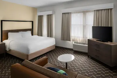 a hotel room with a bed and a television at Residence Inn New Rochelle in New Rochelle