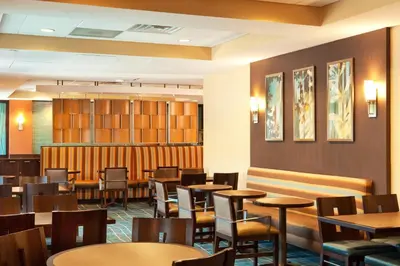 a dining room with tables and chairs at SpringHill Suites by Marriott Tarrytown Westchester County in Tarrytown
