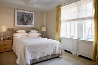 a bedroom with a bed and a window at The Mark New York in New York