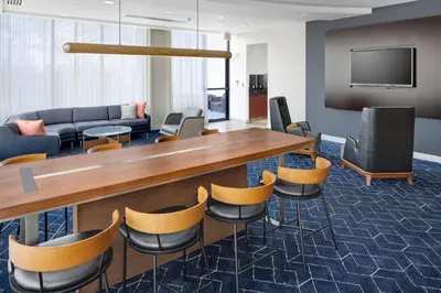 a conference room with a long table and chairs at Courtyard Shelton in Shelton