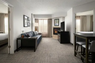 a hotel room with a couch and a fireplace at Residence Inn Mount Olive At International Trade Center in Stanhope