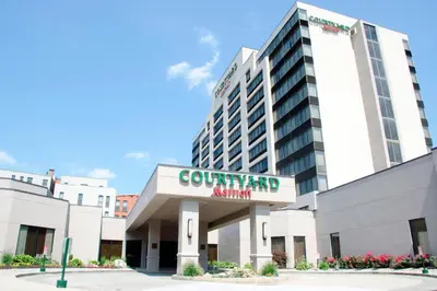 a building with a sign that reads community aquarium at Courtyard Waterbury Downtown in Waterbury