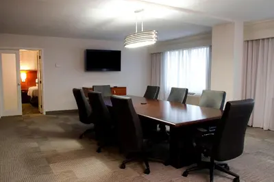 a conference room with a long table and chairs at Courtyard Waterbury Downtown in Waterbury