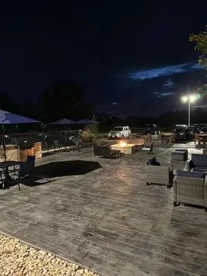a parking lot with tables and chairs at night at Fairfield by Marriott Inn & Suites Wallingford New Haven in Wallingford