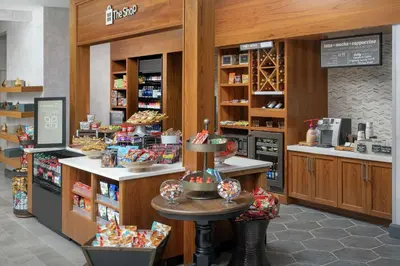 a bakery with a counter in a store at Hilton Garden Inn Westchester Dobbs Ferry in Dobbs Ferry