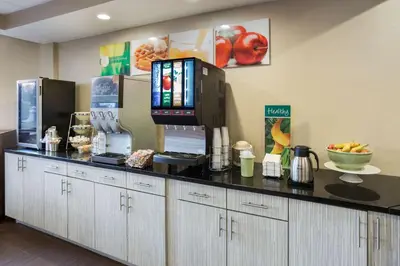 a kitchen with a counter with a coffee maker at Quality Inn Albany Colonie in Albany