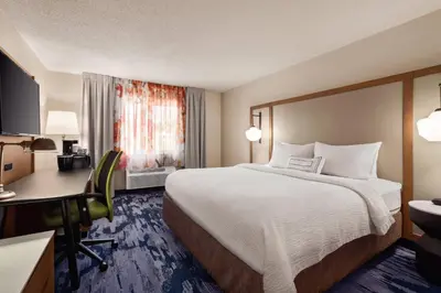 a hotel room with a bed and a desk at Fairfield Inn by Marriott Scranton in Scranton
