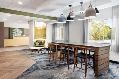 an office lobby with a large table and chairs at Fairfield Inn by Marriott Scranton in Scranton