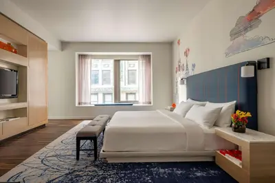 a bedroom with a large bed and a television at Hyatt Centric Wall Street New York in New York