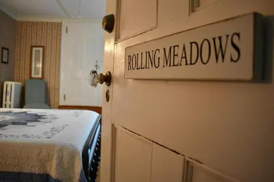 a door with the words rolling meadows written on it at Harbour House Inn B&B in Cheshire