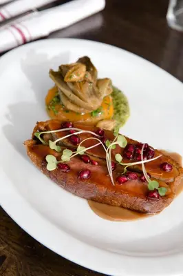 a white plate with a piece of food on it at Wm. Farmer and Sons in Hudson