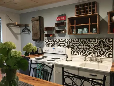 a kitchen with a stove and a sink at Wind in the Willows Overnight in Jefferson