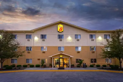 a hotel with a burger sign on the front of it at Super 8 by Wyndham Cromwell/Middletown in Cromwell