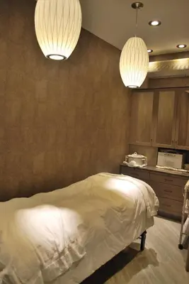 a bedroom with two pendant lights and a bed at Washington Square Hotel in New York