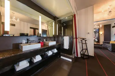 a bathroom with two sinks and a large mirror at Sanctuary Hotel New York in New York