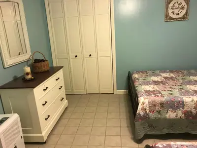 a bedroom with a bed and a dresser at Coolis Apartment in Richfield Springs