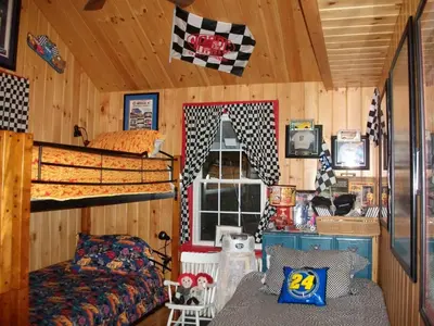 a bedroom with a bunk bed and a bed at A Meadow House in Lakeville