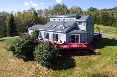 an aerial view of a house with a red deck at The Guest House in Margaretville