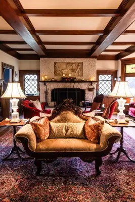a living room with a couch and a fireplace at Manor House Inn in Norfolk