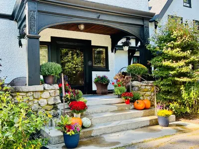 an entrance to a house with pumpkins in front of a door at Manor House Inn in Norfolk