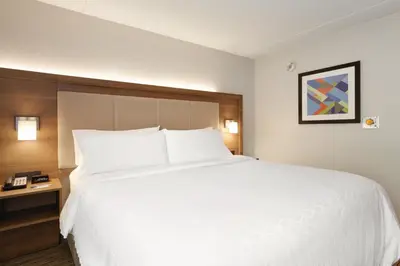 a large white bed in a hotel room at Holiday Inn Express Hartford South - Rocky Hill by IHG in Rocky Hill