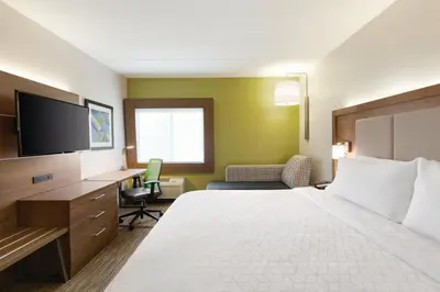 a hotel room with a bed and a desk at Holiday Inn Express Hartford South - Rocky Hill by IHG in Rocky Hill