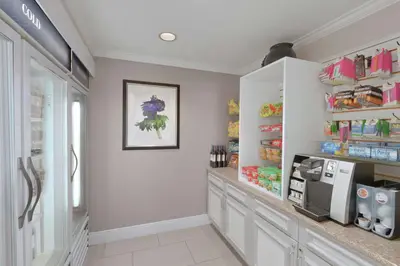 a kitchen with a counter and a refrigerator at Hilton Garden Inn Springfield, MA in Springfield