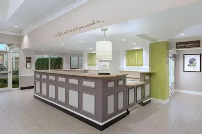 a kitchen with a large island in the middle of a room at Hilton Garden Inn Springfield, MA in Springfield
