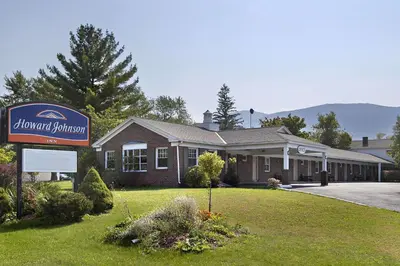a building with a sign in front of it at Howard Johnson by Wyndham Williamstown in Williamstown
