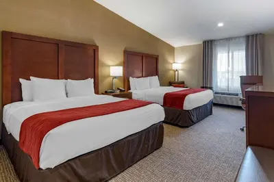 a hotel room with two beds and a window at Comfort Inn Glenmont - Albany South in Glenmont