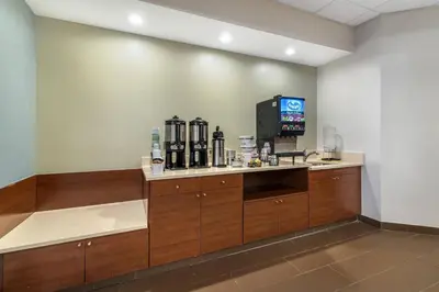 a room with a counter with a coffee maker at The Clocktower Hotel Latham - North Albany, an Ascend Collection Hotel in Cohoes