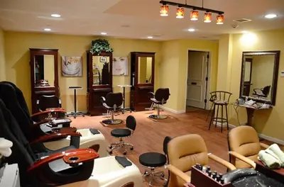 a hair salon with a bunch of chairs and mirrors at Overlook Lodge and Stone Cottages at Bear Mountain in Highland Falls
