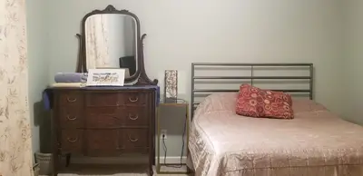 a bedroom with a bed and a dresser and a mirror at Hunter Mt Amazing Views Catskills! 5 Bedrooms! Best Choice! in Hunter
