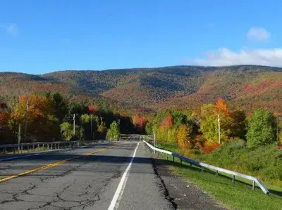 an empty road in the middle of a mountain at Hunter Mt Amazing Views Catskills! 5 Bedrooms! Best Choice! in Hunter