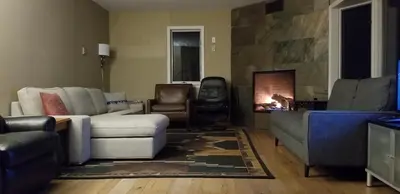 a living room with a couch and a fireplace at Hunter Mt Amazing Views Catskills! 5 Bedrooms! Best Choice! in Hunter