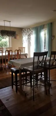 a table and chairs in a room with a dining room at Hunter Mt Amazing Views Catskills! 5 Bedrooms! Best Choice! in Hunter