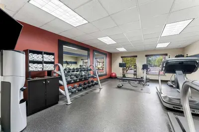a gym with treadmills and machines in a room at Hampton Inn Stroudsburg Poconos in Stroudsburg