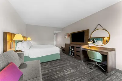 a hotel room with a bed and a desk at Hampton Inn Stroudsburg Poconos in Stroudsburg