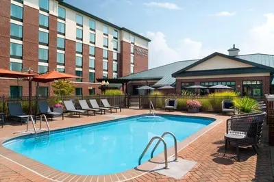 a swimming pool in front of a hotel at Homewood Suites by Hilton Hartford South-Glastonbury in Glastonbury