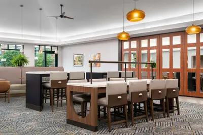 a dining room with a table and chairs at Homewood Suites by Hilton Hartford South-Glastonbury in Glastonbury