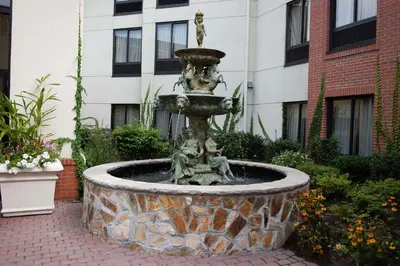 a fountain in the courtyard of a building at Hampton Inn & Suites Fairfield in Fairfield