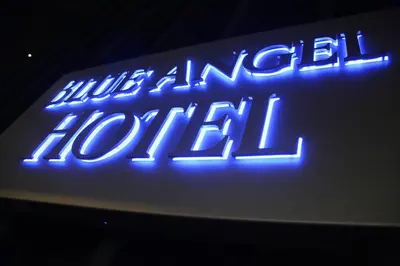 a blue neon sign that says nuclear hotel at The Historic Blue Angel Hotel Lexington Ave, an Ascend Collection in New York