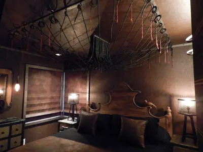 a bedroom with a bed with a net hanging from the ceiling at The Roxbury in Roxbury