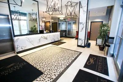 a lobby of a store with a large mirror at Pointe Plaza Hotel in Brooklyn